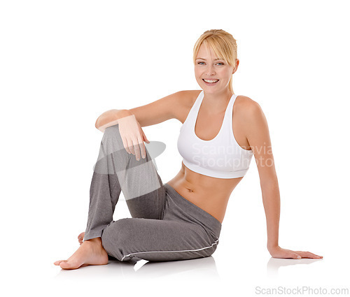 Image of Woman, portrait and fitness on floor in studio for exercise, workout and training with sportswear or happy. Model, athlete and face with smile or confidence for relax and wellness on white background