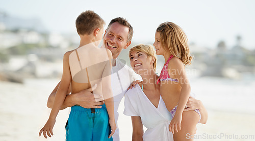 Image of Parents, children and hug on beach in summer for holiday on island or bonding, connection or vacation. Man, woman and siblings with embrace in Florida together or outdoor happiness, travel or relax