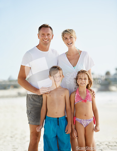 Image of Parents, children and portrait on beach for holiday relax on island or bonding, connection or vacation. Man, woman and siblings with face in Florida together or outdoor happiness, travel or summer