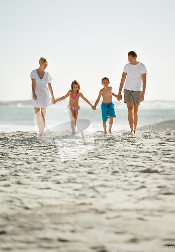 Image of Parents, children and beach on vacation in summer with holding hands and smile for happiness in Florida. Family, adventure and travel for holiday with kids to relax, fun and enjoy trip in seaside.