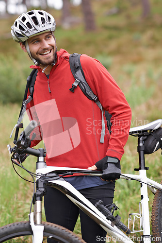 Image of Smile, bike and man cycling in countryside for adventure, discovery or off road sports hobby. Fitness, health and wellness with happy young cyclist on bicycle in nature for cardio training or workout