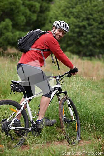 Image of Portrait, bike and man cycling in countryside for adventure, discovery or off road sports hobby. Fitness, health and wellness with young cyclist on bicycle in nature for cardio training or exercise