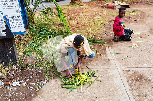 Image of Vendors in Bahir Dar sell handcrafted grass headbands, a symbol of Easter celebrations. Ethiopia