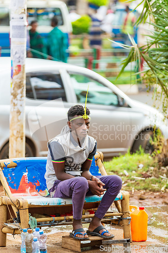 Image of Shoe cleaner on the street during Easter holiday, Bahir Dar, Ethiopia