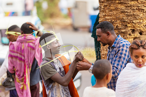 Image of Vendors in Bahir Dar sell handcrafted grass headbands, a symbol of Easter celebrations. Ethiopia