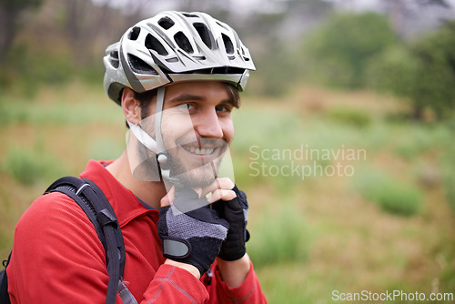 Image of Cycling, happy man and portrait in helmet for safety, protection and gear to travel outdoor in Canada. Bicyclist, face and person with hat getting ready for training, sports and fitness in nature