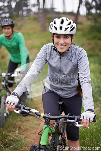 Image of Happy woman, portrait and friends with bicycle in nature for fitness, cycling or off road travel on trail. Female person, rider or biker with smile in forest for outdoor workout or sports exercise