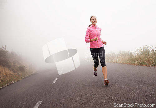 Image of Nature, sports and portrait of woman running on mountain road for race, marathon or competition training. Fitness, exercise and female athlete with cardio workout in misty outdoor woods or forest.