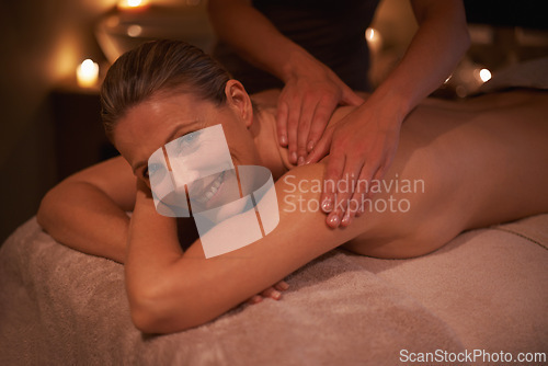 Image of Woman, masseuse and portrait for wellness, relax and self care and back massage on table with smile. Female person, spa day and pampering to destress, peace and detox for calm lifestyle and happy