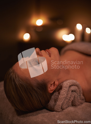 Image of Face massage, spa and wellness with woman, luxury and candle with hospitality and peace. Person, facial and girl with stress relief or healthy with vacation or beauty with holiday, detox or self care