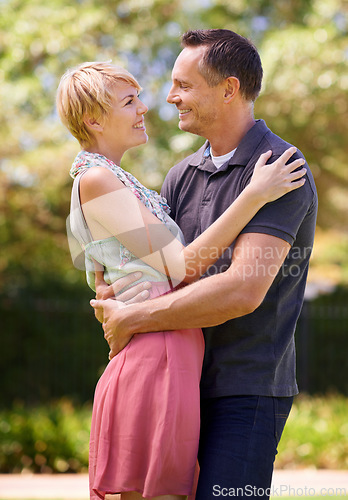 Image of Couple, love and hug with happiness in outdoor for affection, romance and date in Australia. Closeup, relationship and together with smile for bonding, care and trust with commitment for support