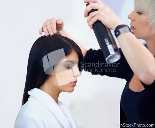 Image of Woman, salon and hairspray for treatment, haircare and beauty with hairdresser or hair stylist. Person, backstage and beautician for glamour, style and cosmetics for behind the scenes preparation