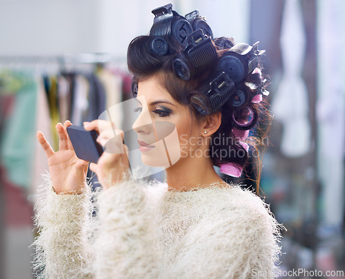 Image of Model, woman and phone in hairdresser for beauty, haircare and behind the scenes with social media search. Salon, backstage and person with smartphone for internet scroll or movie for getting ready