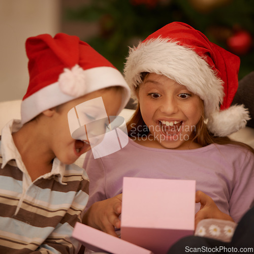 Image of Wow, children and surprise with a Christmas gift for tradition, celebration or festive joy in their home. Siblings, box and kids in living room unboxing present for holiday, event or package in house