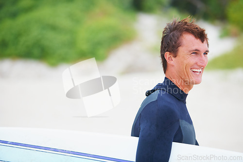 Image of Man, surfer and face or smile on beach with surfboard for adventure, vacation or holiday. Surfing, person and happy with travel in nature for exercise, water sports or mockup in summer with wetsuit