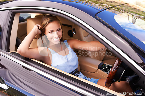 Image of Portrait, travel and happy woman in sports car, driving or road trip with motor vehicle by window in Canada. Person, face and luxury automobile for journey, vacation and adventure in transportation