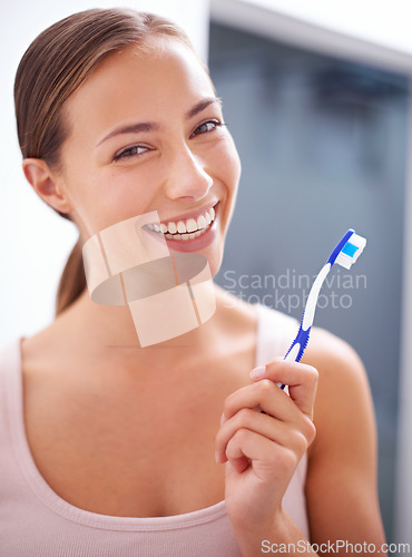 Image of Portrait, smile and toothbrush for dental care with woman in bathroom of home for teeth whitening. Face, oral hygiene and happy young person in apartment to prevent tooth decay or gum disease