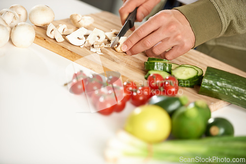 Image of Diet, cooking and hands cutting vegetables on kitchen counter with salad, wellness and nutrition in home. Wood board, knife and healthy food process with brunch, chef and vegan meal prep in apartment