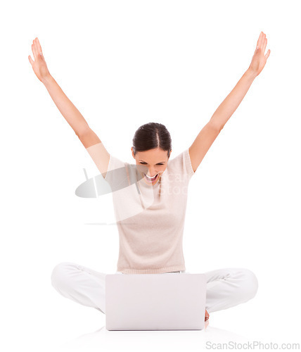 Image of Woman, laptop and celebration or excited in studio with arms up for good news, promotion or winning. Female person, online and white background with mockup or announcement victory, reward or lottery