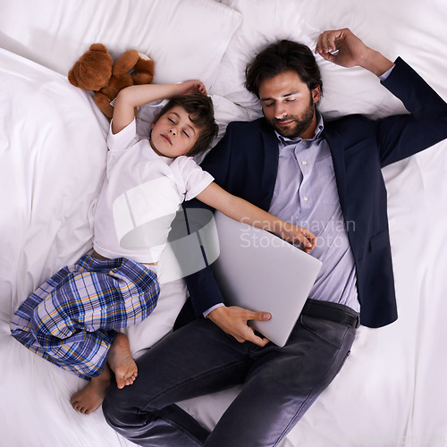 Image of Tired, businessman and sleep with son, laptop for rest with technology and suit. Father, child and bedroom with fatigue, love and above with freelance peace or remote work for stress management