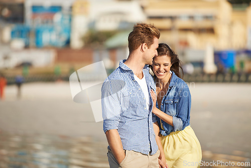 Image of Couple, laugh and walk on beach for romantic date, jokes and bonding together on holiday in Italy. Happiness, boyfriend and girlfriend for funny outing or rest and relaxation on summer getaway