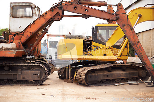 Image of Crane, machine and industry with vehicle, track and transportation for driving with manufacturing. Construction, tractor and outdoor in junkyard, plant and moving for steel industry in environment