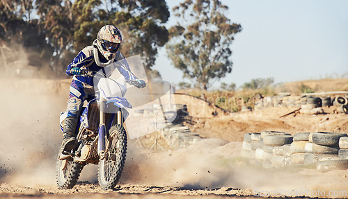 Image of Motorcycle, person and speed with dust cloud for games, contest or challenge in action for extreme sports. Racer, motorbike and dirt on path, road and trail in nature with fast transport in summer