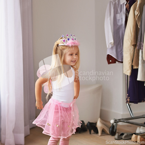 Image of Princess, dance and portrait of girl with costume in home for fun, play or pretend for happy kids game. Fantasy, fashion and child in creative fairy fancy dress with wings, tiara and smile in bedroom