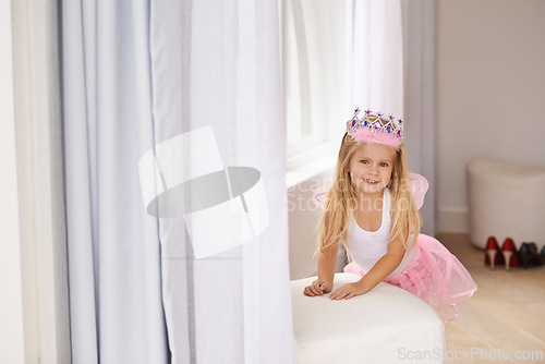 Image of Princess, costume and portrait of girl in home for fun, playing and pretend for happy kids game. Fantasy, fashion and child in creative fairy fancy dress with wings, tiara and smile in bedroom.