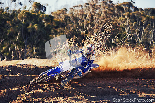Image of Person, professional motorcyclist and dirt track for competition, extreme sports or outdoor race. Expert rider on motorbike or scrambler for sand course, challenge or off road rally track in nature