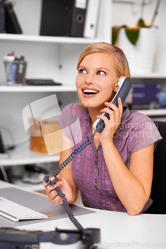 Image of Happy secretary, woman and landline telephone with listening, deal or contact with excited face in office. Receptionist, person and employee with smile for phone call with news, story or info at job