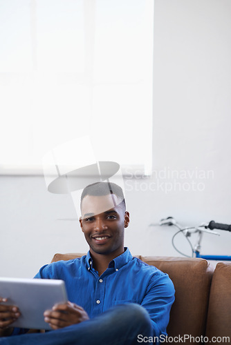 Image of Man, tablet and relax in portrait at home, subscribe and internet for web or blog. Black male person, smile and streaming entertainment on couch, mockup space and app for online shopping on weekend