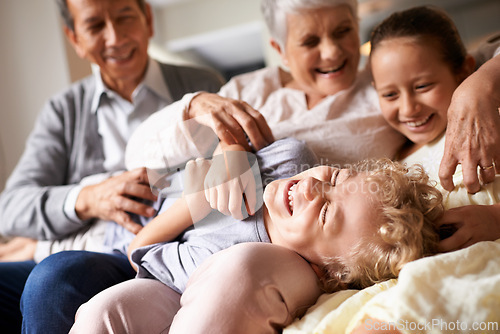 Image of Grandparents, home and grandchildren with happiness, funny and bonding together with vacation and playing. Family, old man and elderly woman with kids and laughing with humor and cheerful with love