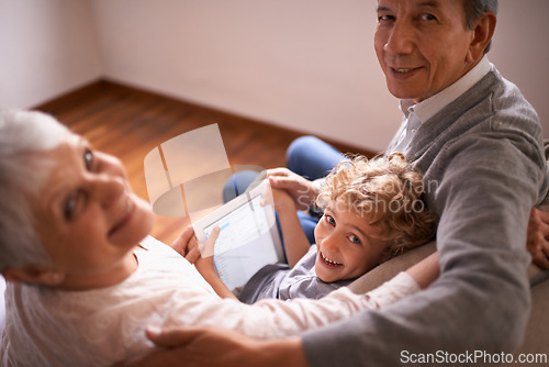 Image of Child, grandparents and tablet or portrait for online technology or communication, teaching or connection. Elderly couple, retirement and kid with internet learning in apartment, together or bonding