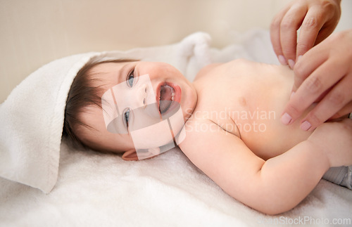 Image of Portrait, baby and boy with diaper, smile and excited with blanket or relax with happiness. Face, infant or kid with humor or laughing with wellness or healthy with nappy or joyful with child or home