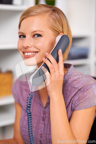 Image of Secretary, woman and smile with landline telephone for listening, deal or contact with portrait in office. Receptionist, person and happy employee with phone call for news, story or info at workplace