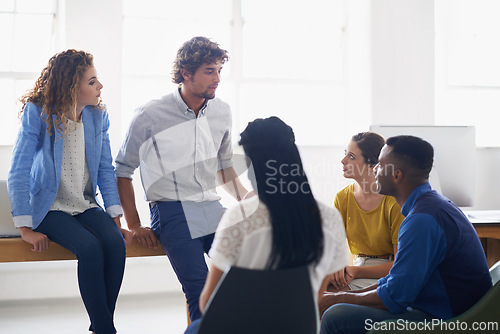 Image of People, communication and planning in creative business, problem solving and discussion for ideas in office. Staff, diversity and designers in meeting for project, collaboration and support in team