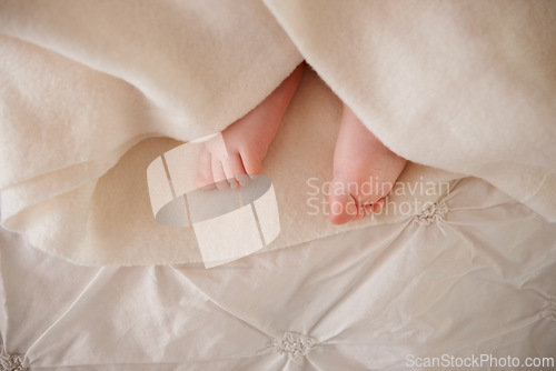 Image of Baby, feet and toes or blanket on bed for childhood development or nursery sleeping, relax or resting. Kid, wellness and childcare as closeup for wellbeing nap or dreaming nurture, caring or calm