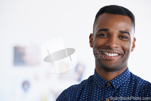 Image of Businessman, portrait and smile confidence in creative studio as a graphic designer for project, proposal or small business. Black man, face and workspace for entrepreneur career, startup or office