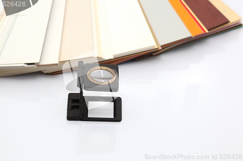 Image of paper samples and lense