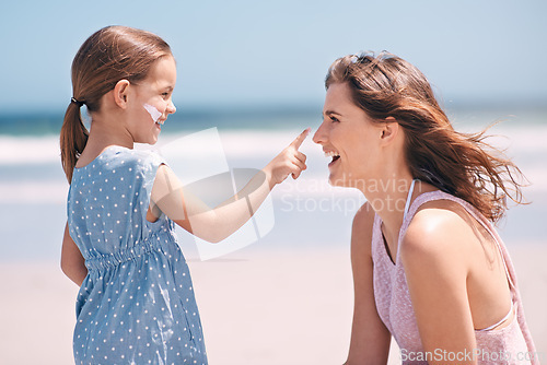 Image of Child, mother and nose with sunscreen on beach for summer protection for healthy skin, safety or weekend. Woman, daughter and happy in Florida for bonding holiday or vacation, sunshine or outdoor