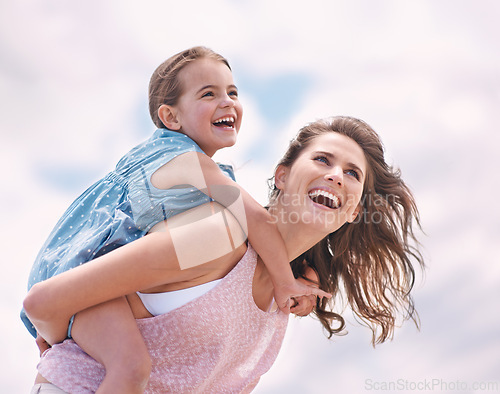 Image of Mother, child and piggyback, happy on the beach for bonding and love, travel and vacation in Mexico. Freedom, care and trust, woman and daughter playing game with joy and family time together outdoor