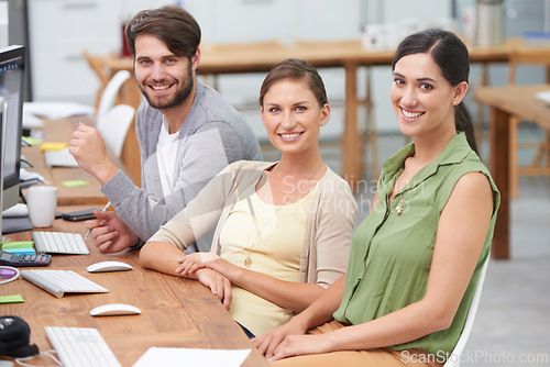 Image of Portrait, freelancers and group smiling in office, desk or computer for collaboration, teamwork and creativity. Partnership, people and employees at workplace for writers, business or professionalism