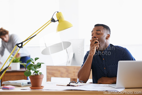 Image of Business, yawn and tired black man in office and stress, burnout or fatigue by laptop in creative startup. Bored, sleepy and exhausted professional, overworked or designer with brain fog for deadline