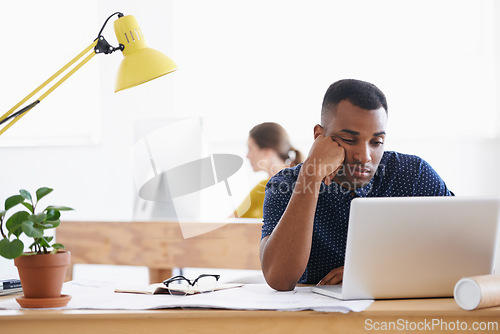 Image of African architect, depressed and tired from failed project, upset and mockup space. Nigerian male, sad and exhausted with laptop, documents and frustrated by illustrations, designs or drawings