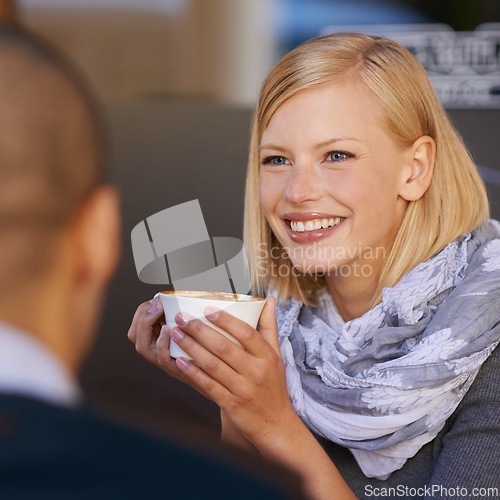 Image of Woman, relax and smile in morning with coffee for start of day, together with friend and talking in cafe for catchup before work. Female person, calm and happy with cup expresso with discussion