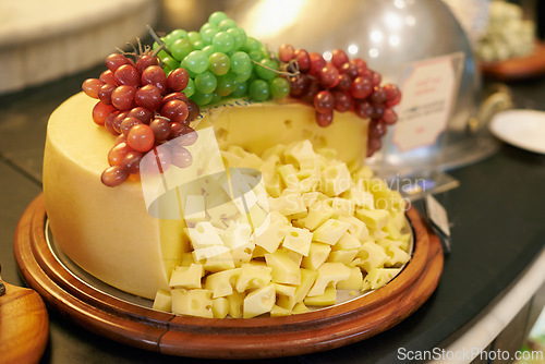 Image of Food, grapes and cheese in restaurant buffet for catering service, snack selection and banquet for eating. Cafeteria, fine dining and closeup of table for lunch, supper and dinner event for wellness