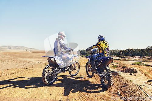 Image of Rear view, racer or people on motorcycle outdoor on dirt road with relax after driving, challenge and competition. Motocross, motorbike and dirtbike driver with helmet on offroad and path for racing