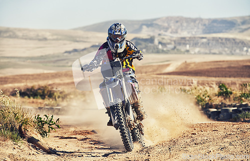 Image of Person, professional motorcyclist and dirt track for race, extreme sports or outdoor competition. Expert rider on motorbike or scrambler for sand course, challenge or off road rally in nature dunes