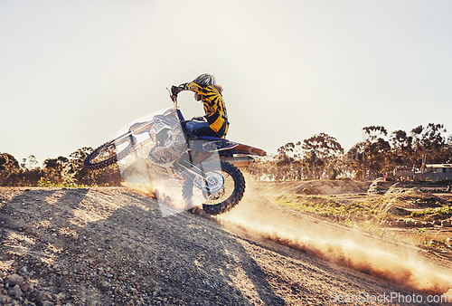 Image of Dust, race and man on dirt bike in desert with adventure, adrenaline and speed in competition, Extreme sport, trick and athlete on off road motorcycle for challenge, power or danger on action course